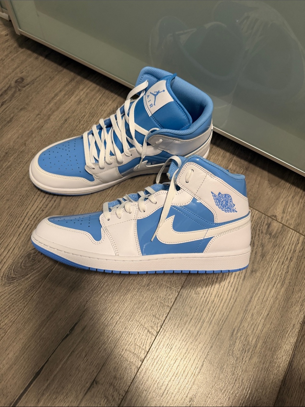 Air Jordan 1 Mid-Top Sneakers in White and Light Blue